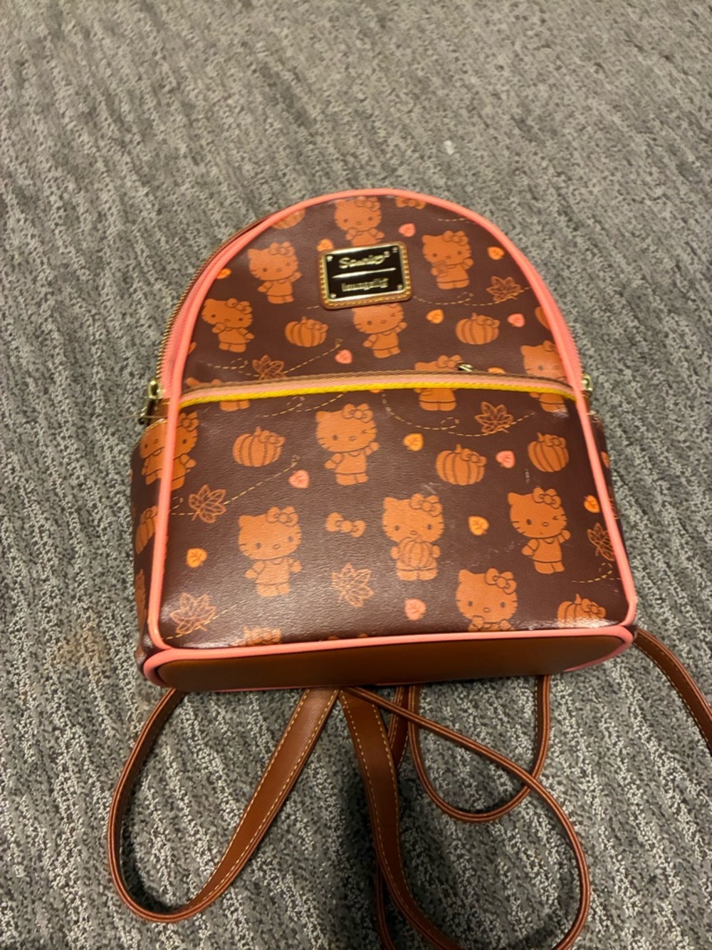 LOUNGEFLY. Hello Kitty Brown Backpack with Orange Print and Pink Trim